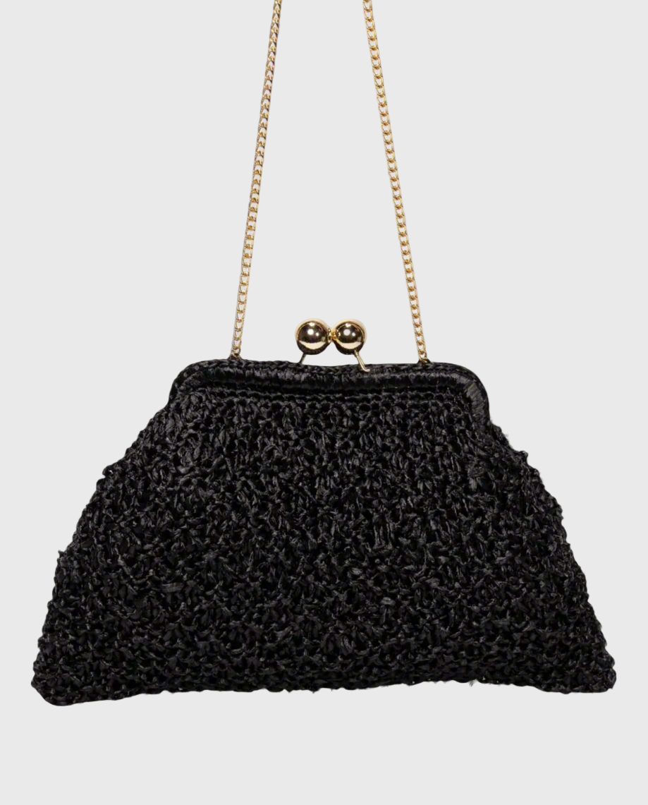 A black raffia clutch with a chain handle and ball clasp closure, handcrafted in Florence, Italy.
