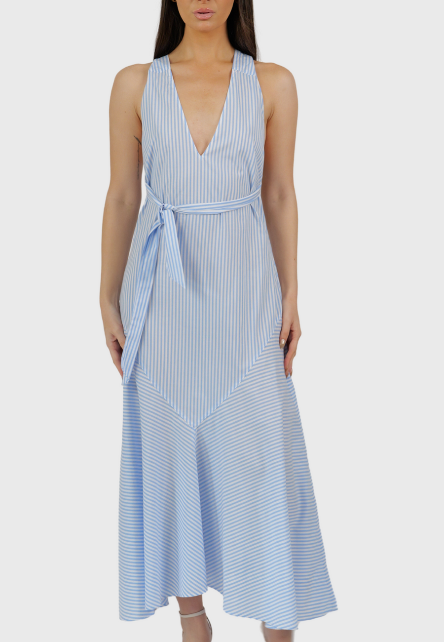 Woman wearing a blue and white striped dress on a white background
