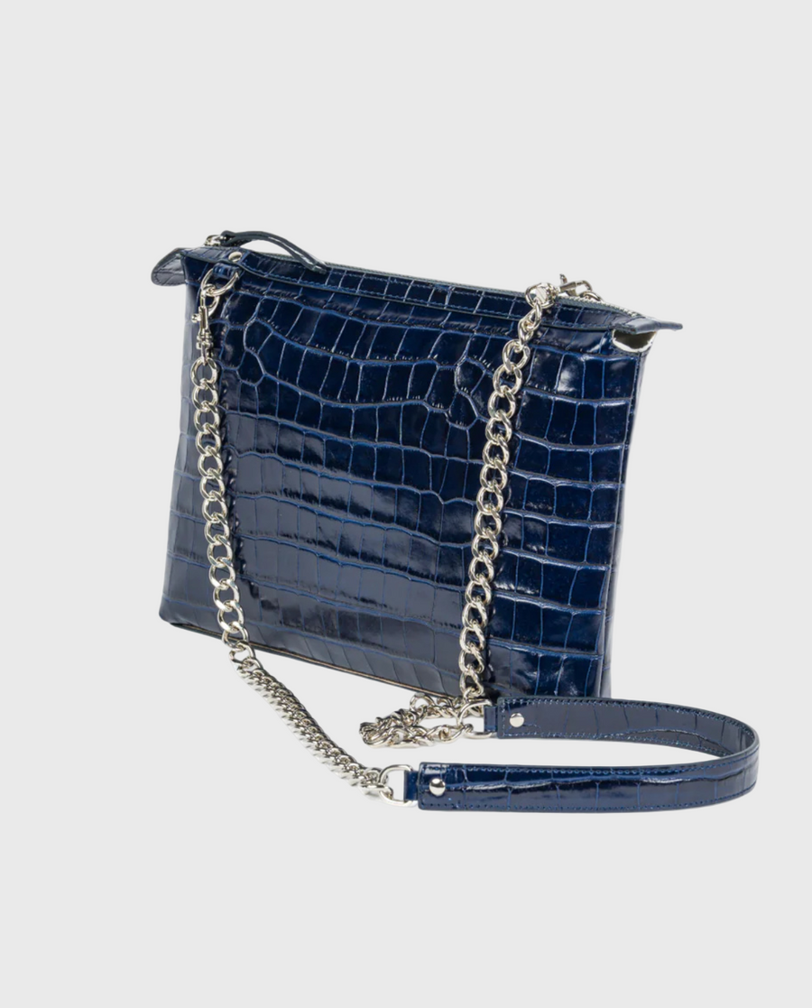 A navy blue croc-embossed leather crossbody bag with a silver-tone chain strap and a short handle
