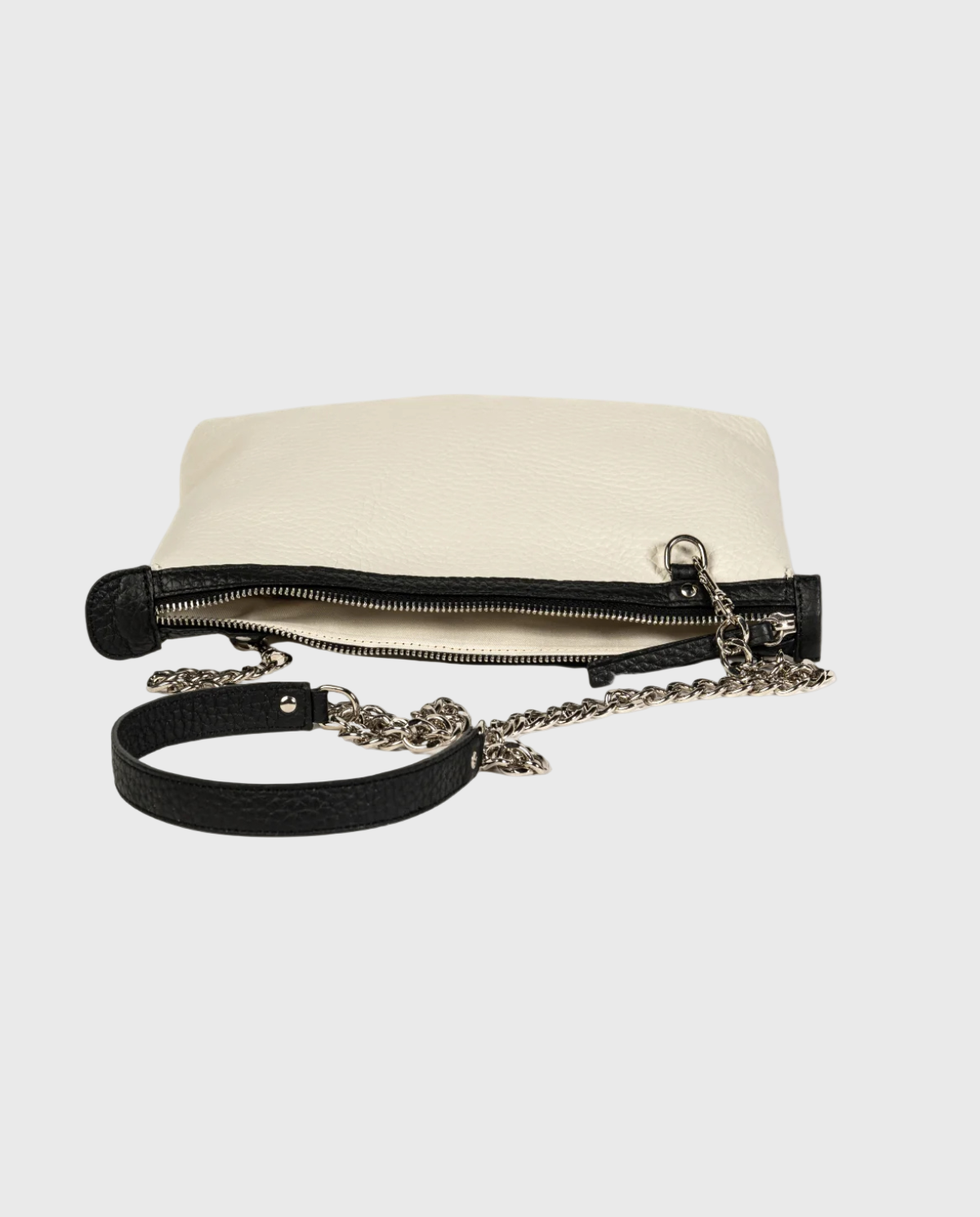 Black handbag with chain strap and zipper details on a white background