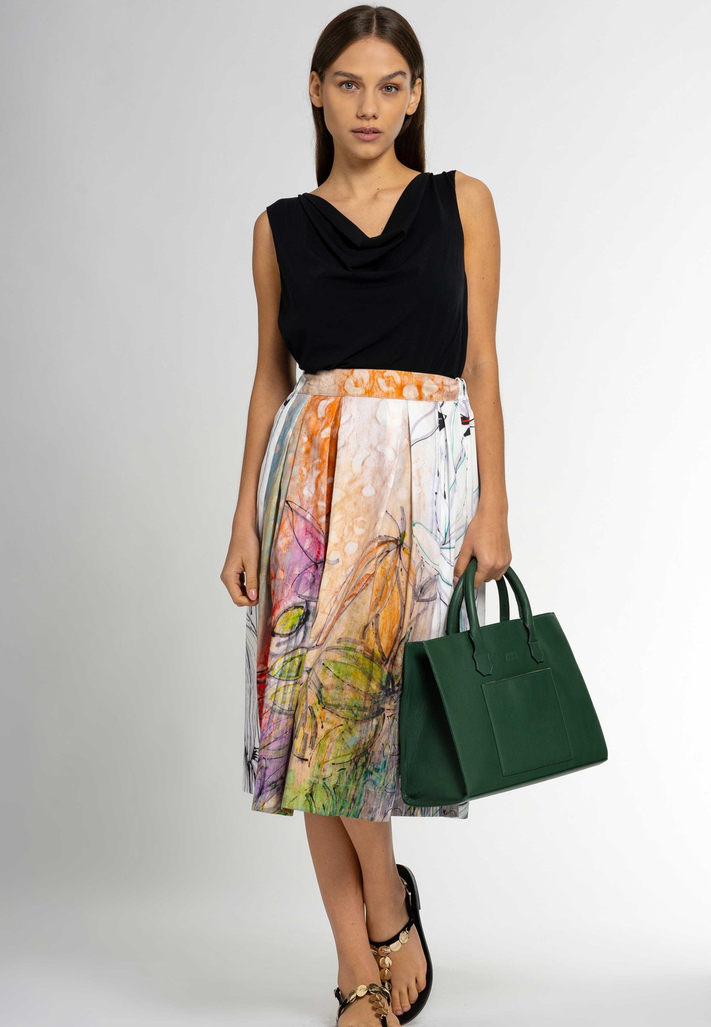 Looking for a chic and feminine top that flatters your figure? Look no further than the Lori cowl neck sleeveless top. Made from luxurious Italian viscose, this figure-hugging top is perfect for any occasion.