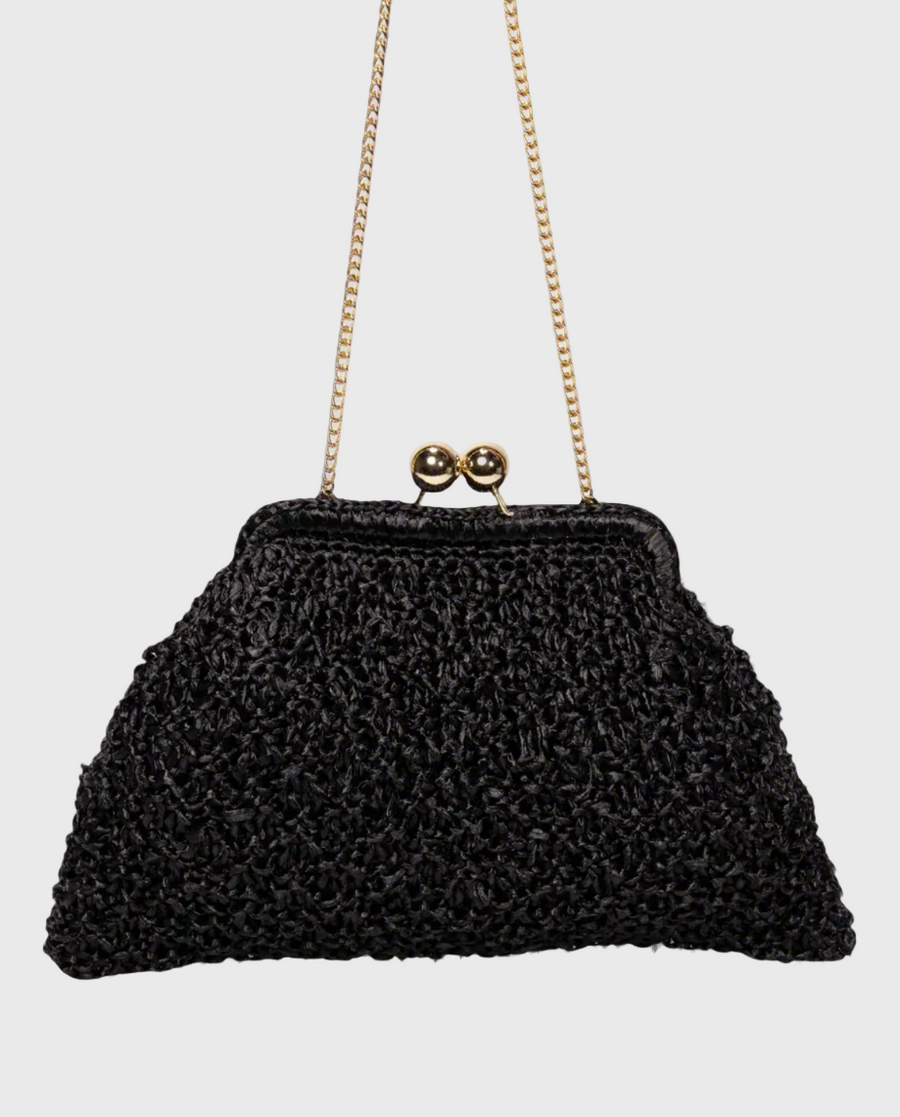 A black raffia clutch with a chain handle and ball clasp closure, handcrafted in Florence, Italy.